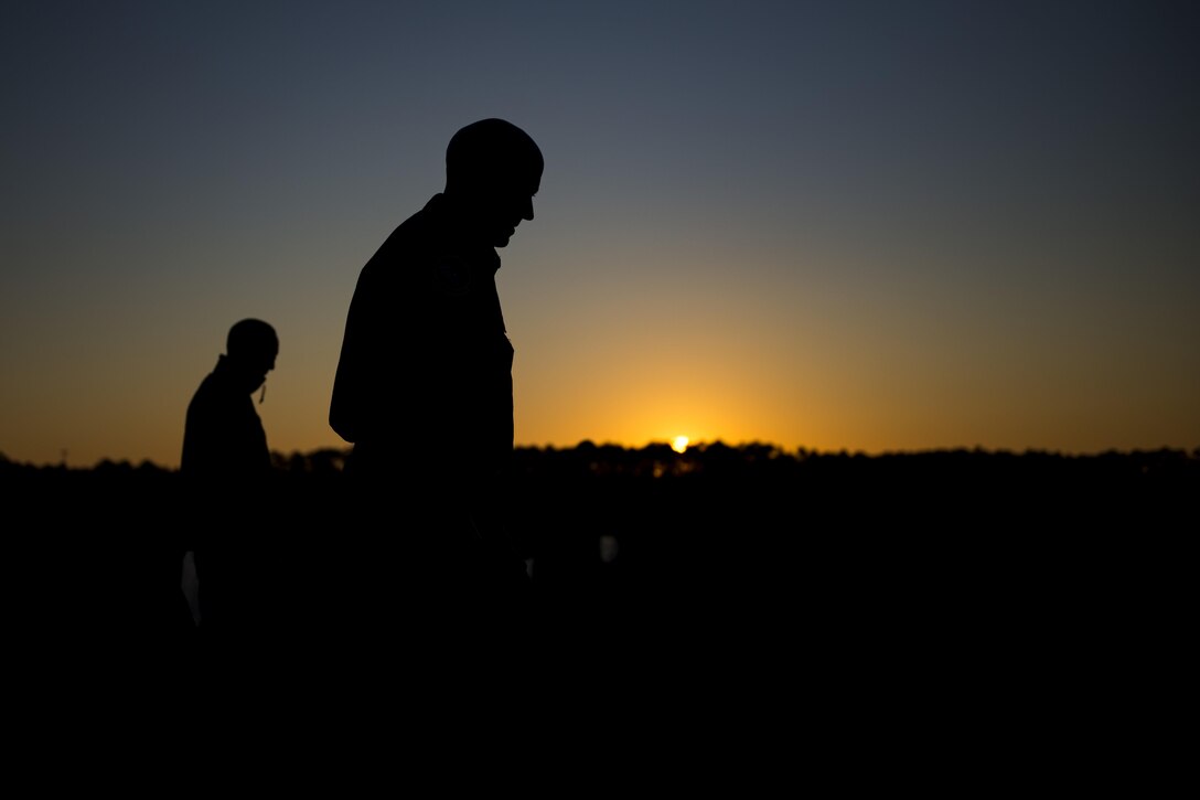 Airmen search for trash during a foreign object debris (FOD) walk, Oct. 30, 2017, at Moody Air Force Base, Ga. The FOD walk was performed following the Thunder Over South Georgia Air Show, to remove any debris that could potentially cause damage to aircraft or vehicles. (U.S. Air Force photo by Airman 1st Class Erick Requadt)