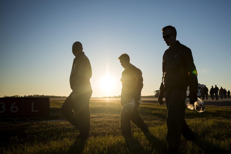 Airmen make their way onto the flight line during a foreign object debris (FOD) walk, Oct. 30, 2017, at Moody Air Force Base, Ga. The FOD walk was performed following the Thunder Over South Georgia Air Show, to remove any debris that could potentially cause damage to aircraft or vehicles. (U.S. Air Force photo by Airman 1st Class Erick Requadt)