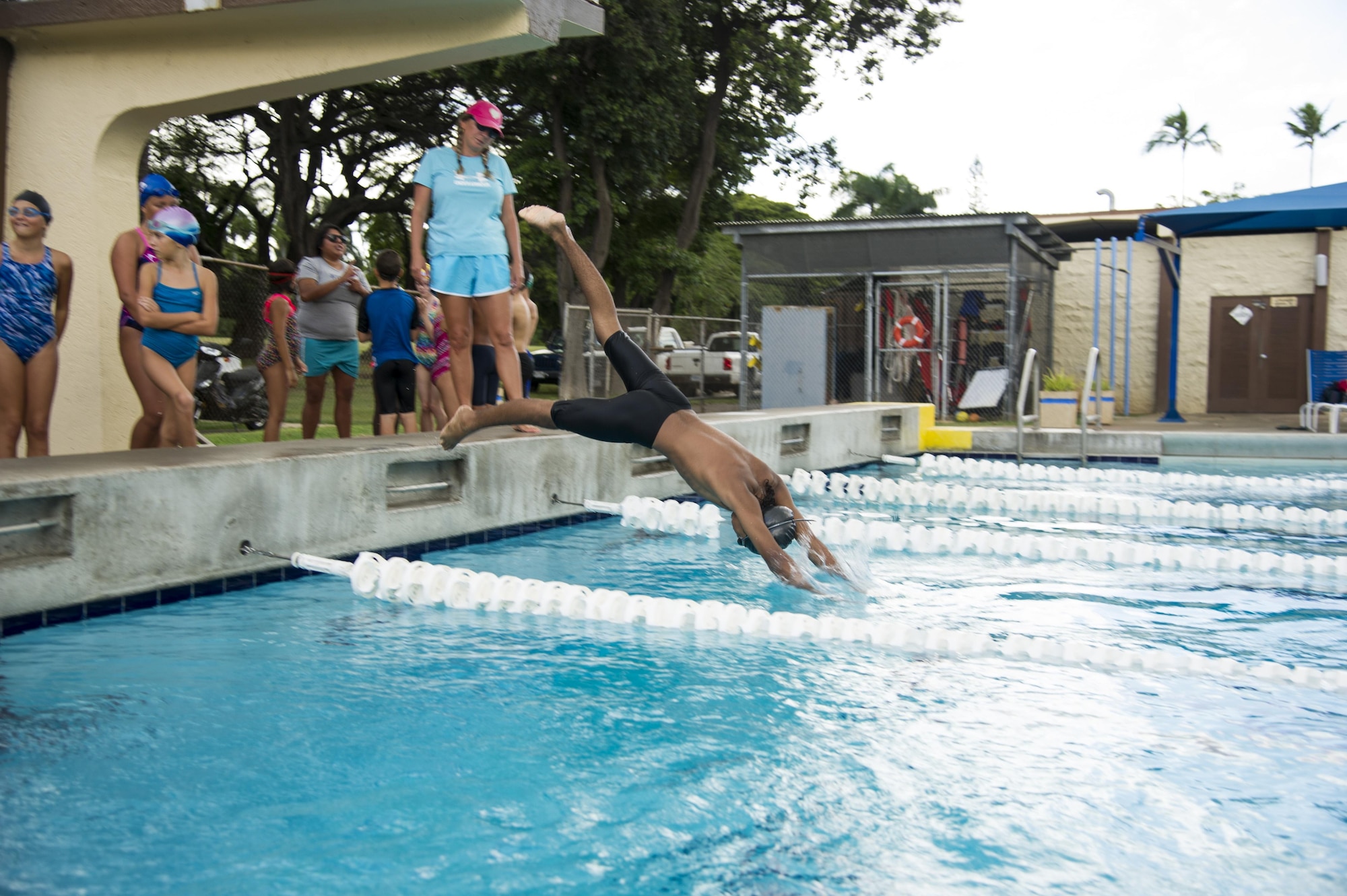 Jolena Adams, Hickam Hurricanes head coach, monitors team members’ dive start techniques during training at Scott Pool on Joint Base Pearl Harbor-Hickam, Hawaii, Oct. 24, 2017. The Hickam Hurricanes is a student club that develops skills for local, state, national and international levels of competitive swimming in accordance with the rules of U.S.A. Swimming, Inc. (U.S. Air Force photo by Tech. Sgt. Heather Redman)