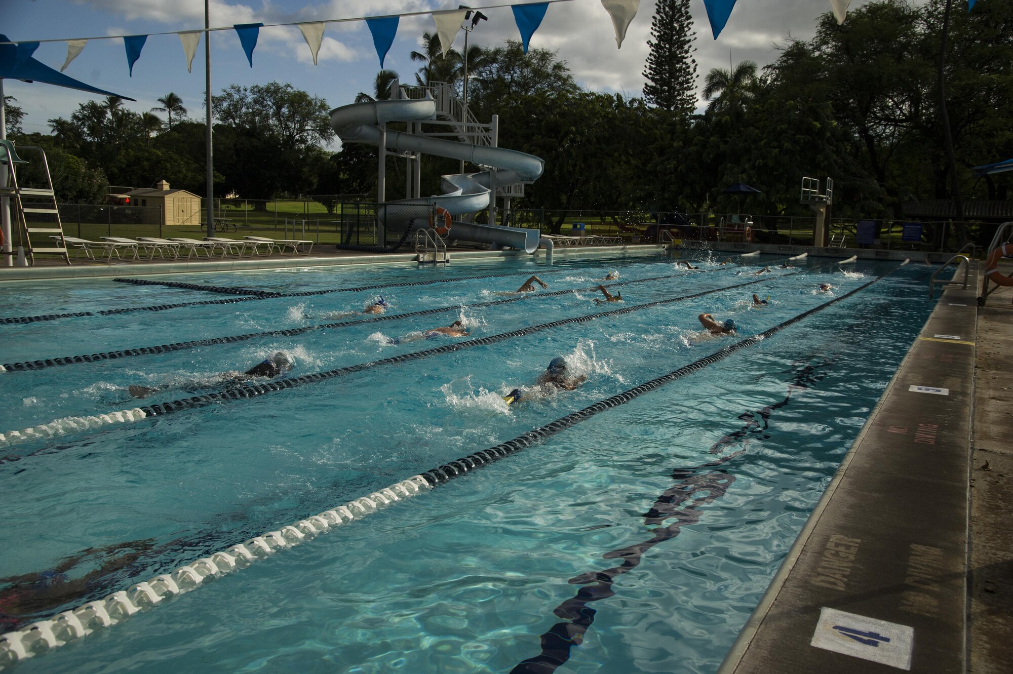 Members of the Hickam Hurricanes free style swim during practice warm-up at Scott Pool on Joint Base Pearl Harbor-Hickam, Hawaii, Oct. 24, 2017. The Hickam Hurricanes is a student club that develops skills for local, state, national and international levels of competitive swimming in accordance with the rules of U.S.A. Swimming, Inc. (U.S. Air Force photo by Tech. Sgt. Heather Redman)