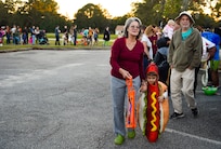 Fall Fest attendees stand in line to trunk-or-treat outside the library at Joint Base Charleston, S.C., Oct. 27, 2017.