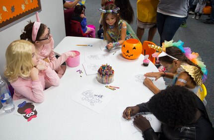 Children color in artwork at the library at Joint Base Charleston, S.C., Oct. 27, 2017.