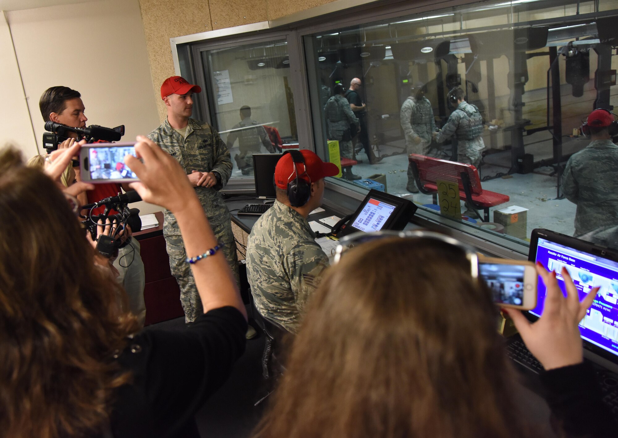 Reporters from local media outlets tour the 81st Security Forces Squadron indoor firing range during Media Day Oct. 26, 2017, on Keesler Air Force Base, Mississippi. In order to better understand Keesler’s mission, the reporters also toured the air traffic control tower, the Keesler Medical Center and a 333rd Training Squadron cyber training course. (U.S. Air Force photo by Kemberly Groue)