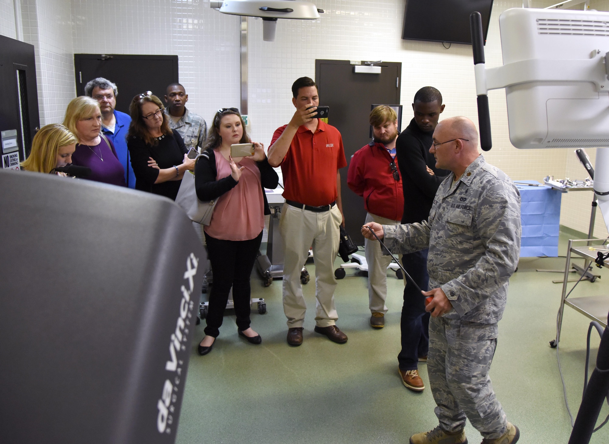 Maj. Scott Thallemer, 81st Surgical Operations Squadron informatics officer and robotics program coordinator, provides reporters from local media outlets with a briefing on the capabilities of robotics surgery at the clinical research lab during Media Day Oct. 26, 2017, on Keesler Air Force Base, Mississippi. In order to better understand Keesler’s mission, the reporters also toured the air traffic control tower, the 81st Security Forces Squadron indoor firing range and a 333rd Training Squadron cyber training course. (U.S. Air Force photo by Kemberly Groue)