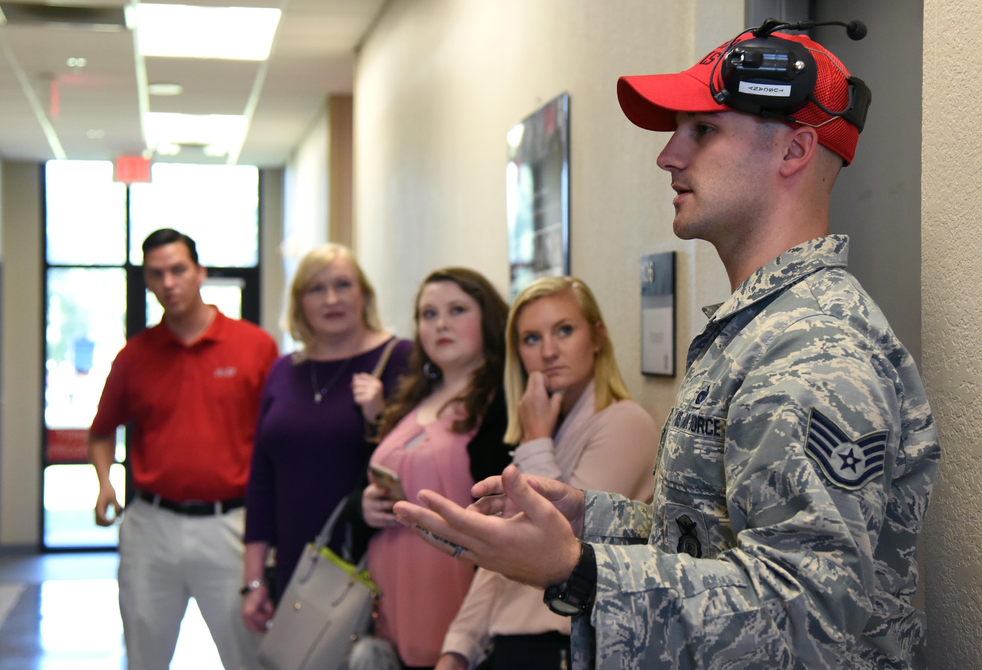 Staff Sgt. Jeffrey Tuscany, 81st Security Forces Squadron combat arms NCO in charge, briefs reporters from local media outlets during a tour the 81st SFS indoor firing range during Media Day Oct. 26, 2017, on Keesler Air Force Base, Mississippi. In order to better understand Keesler’s mission, the reporters also toured the air traffic control tower, the Keesler Medical Center and a 333rd Training Squadron cyber training course. (U.S. Air Force photo by Kemberly Groue)