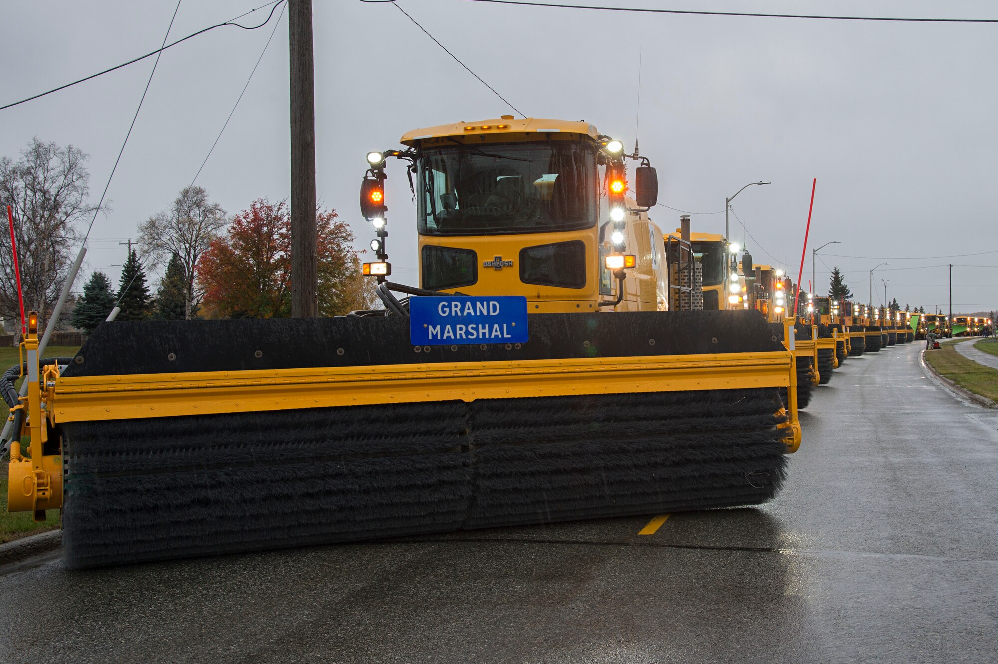 The 773rd Civil Engineer Squadron conducts the annual Snow & Ice Parade at Joint Base Elmendorf-Richardson, Alaska, Oct. 5, 2017. The parade showcased snow-removal vehicles on a loop starting at the Arctic Warrior Events Center. Regardless of the amount of snowfall during the winter, snow barn personnel work to keep the runways and roads clear and ready. (U.S Air Force photo by Airman 1st Class Valerie Monroy)