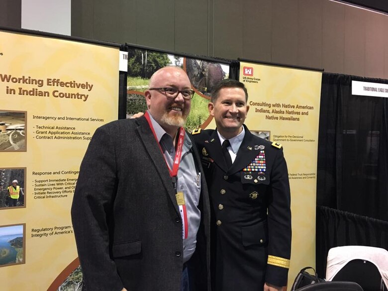 At left, Michael Fedoroff briefs Deputy Commanding General Maj. Gen. Donald Jackson while discussing Tribal Nations Technical Center work at the National Congress of the American Indian held in Milwaukee, Wis. (Courtesy photo)