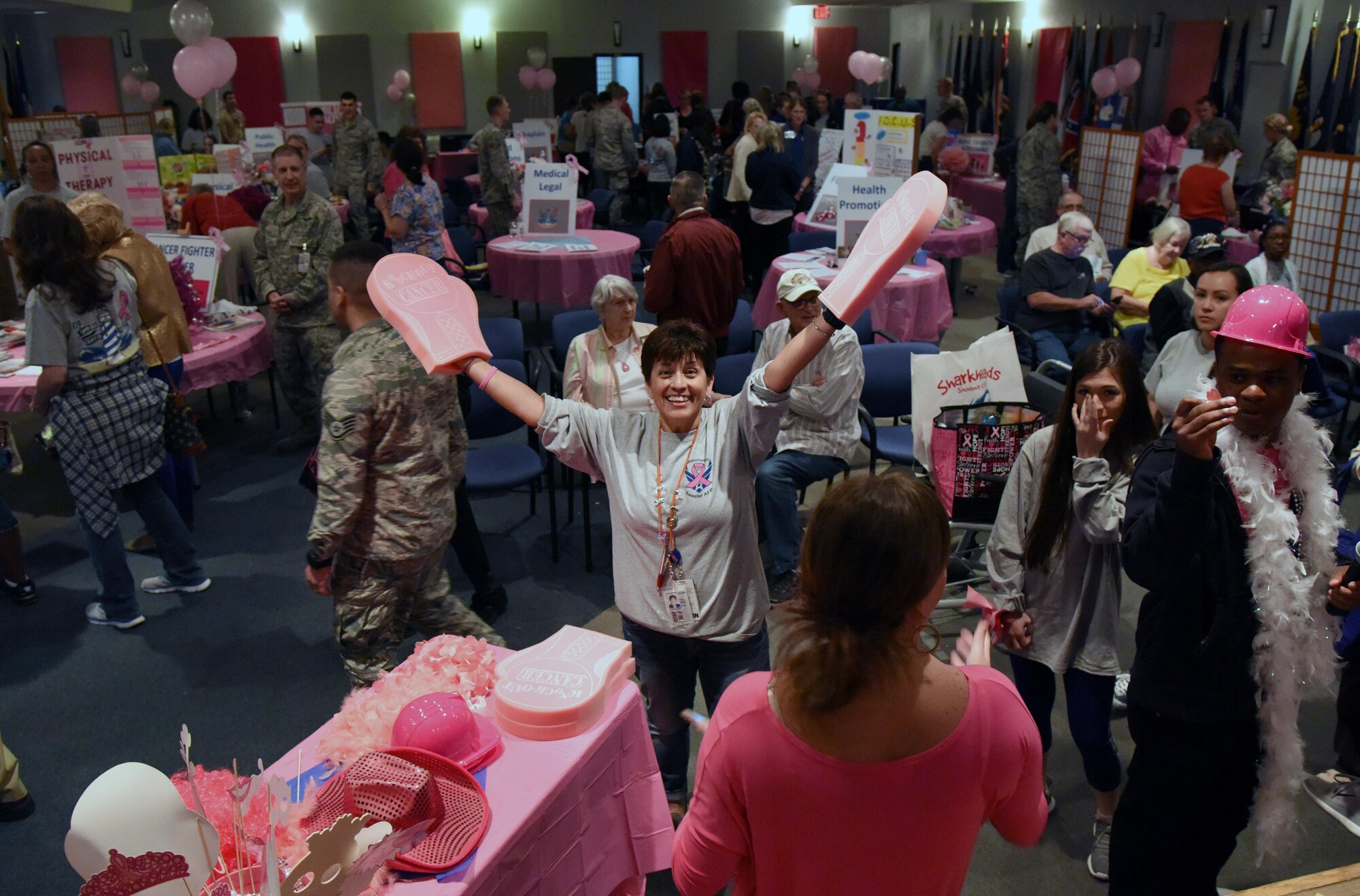 Martha Prieto-Moreno, 81st Medical Group patient advocate, welcomes personnel to the 6th Annual Mammothon Cancer Screening and Preventative Health Fair at the Don Wylie Auditorium Oct. 27, 2017, on Keesler Air Force Base, Mississippi. The 81st Medical Group hosted the walk-in event which included screenings for multiple types of cancer and chronic diseases in honor of Breast Cancer Awareness Month. Flu shots were also provided upon request. (U.S. Air Force photo by Kemberly Groue)