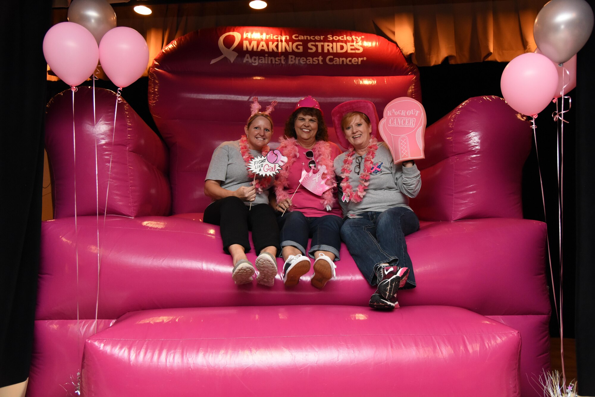 Master Sgt. Jamie Cleveland, 81st Surgical Operations Squadron physical therapy NCO in charge; Letitia Landry, 81st Medical Group medical law paralegal and Sharay Windham, 81st MSGS physical therapist assistant, pose for a photo during the 6th Annual Mammothon Cancer Screening and Preventative Health Fair at the Don Wylie Auditorium Oct. 27, 2017, on Keesler Air Force Base, Mississippi. The 81st Medical Group hosted the walk-in event which included screenings for multiple types of cancer and chronic diseases in honor of Breast Cancer Awareness Month. Flu shots were also provided upon request. (U.S. Air Force photo by Kemberly Groue)
