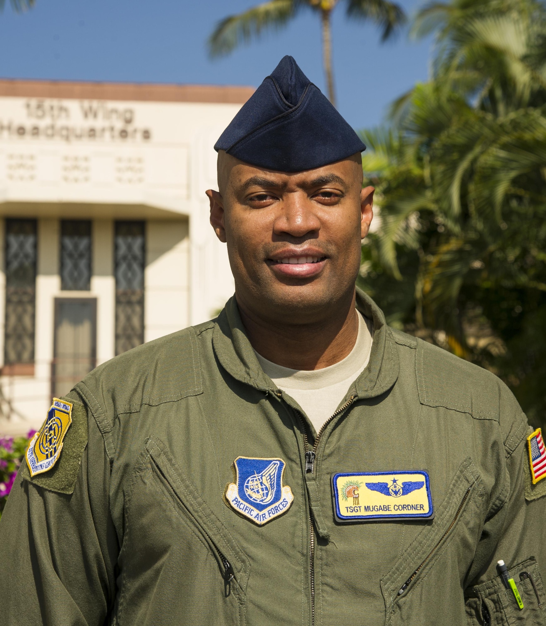 Tech. Sgt. Mugabe Cordner, 15th Operations Group evaluator flight engineer, stands  in front of the 15th Wing Headquarters building on Joint Base Pearl Harbor-Hickam, Oct. 30, 2017. Cordner stopped and de-escalated a fight on board United Airlines flight 534 from Honolulu, Hawaii, to Los Angeles, California, on August 21, 2017. (U.S. Air Force photo by Tech. Sgt. Heather Redman)