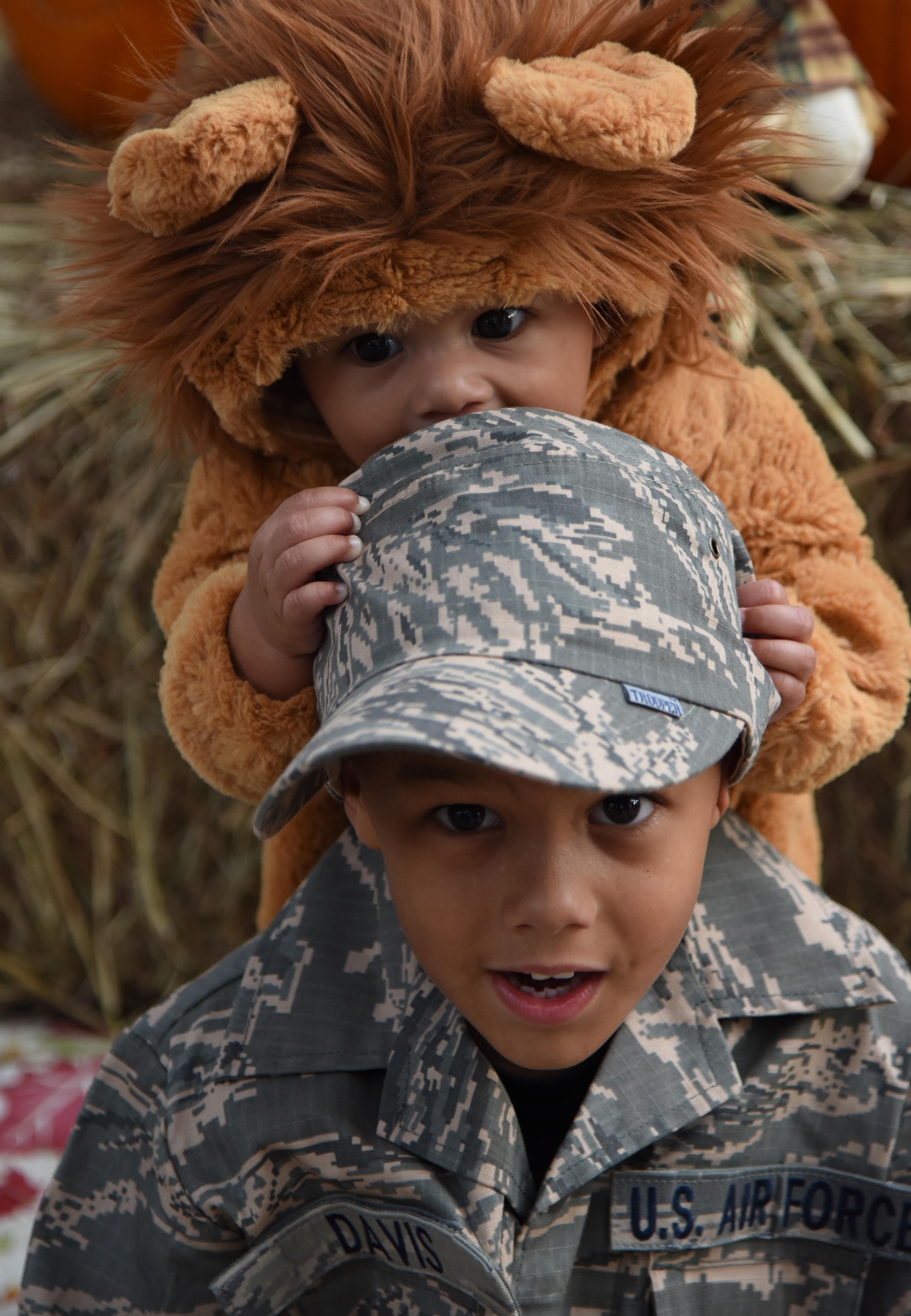 Deron and Isaiah Davis, sons of Master Sgt. Glenn Davis, 335th Training Squadron personnel apprentice course NCO in charge, pose for a photo during Ghouls in the Park at Marina Park Oct. 27, 2017, on Keesler Air Force Base, Mississippi. Ghouls in the Park also featured an alien bus, a haunted house, “Trunk or Treat” and games for children of all ages. (U.S. Air Force photo by Kemberly Groue)