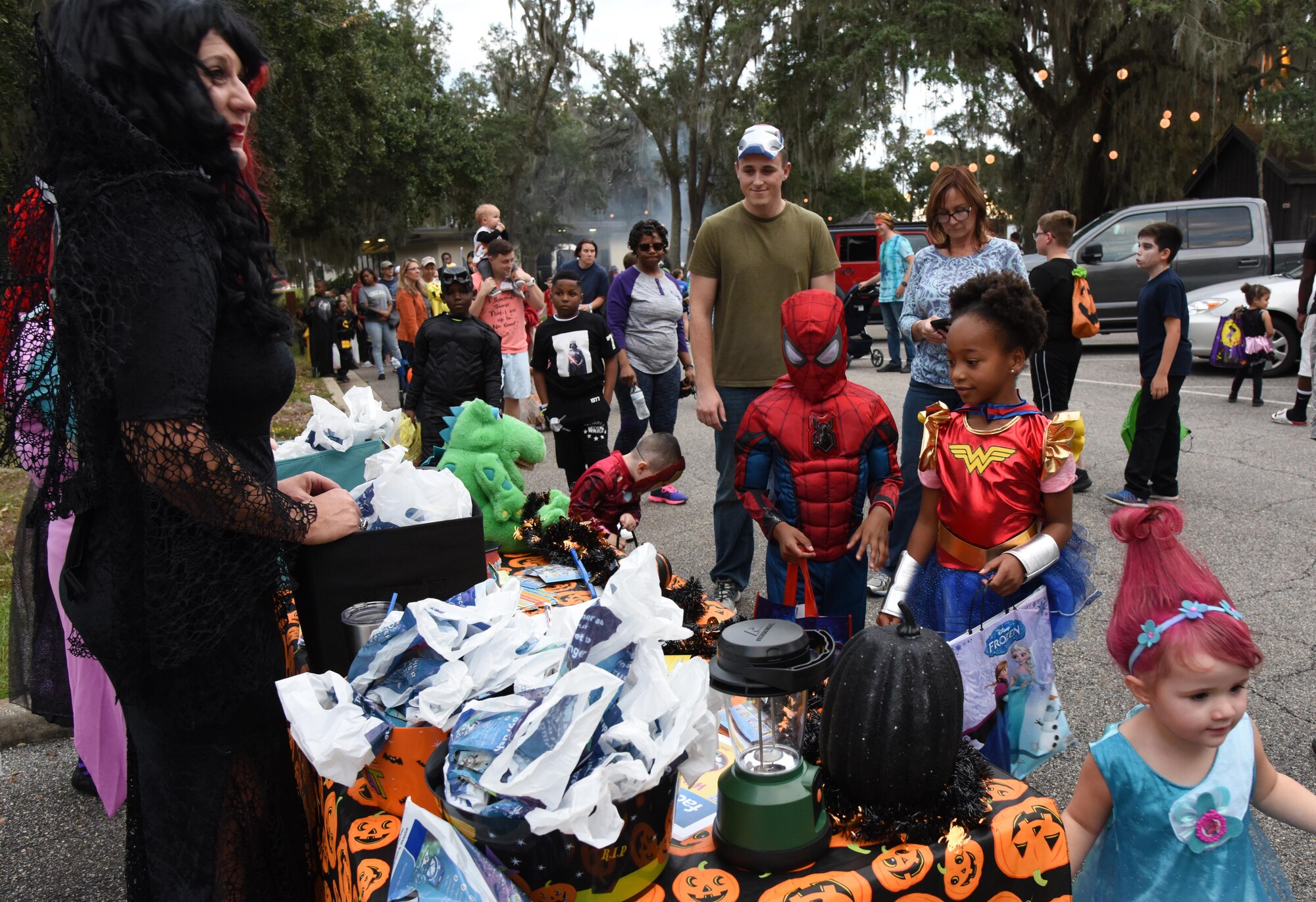 Keesler personnel make their way through the Marina Park collecting candy during Ghouls in the Park Oct. 27, 2017, on Keesler Air Force Base, Mississippi. Ghouls in the Park also featured an alien bus, a haunted house, “Trunk or Treat” and games for children of all ages. (U.S. Air Force photo by Kemberly Groue)
