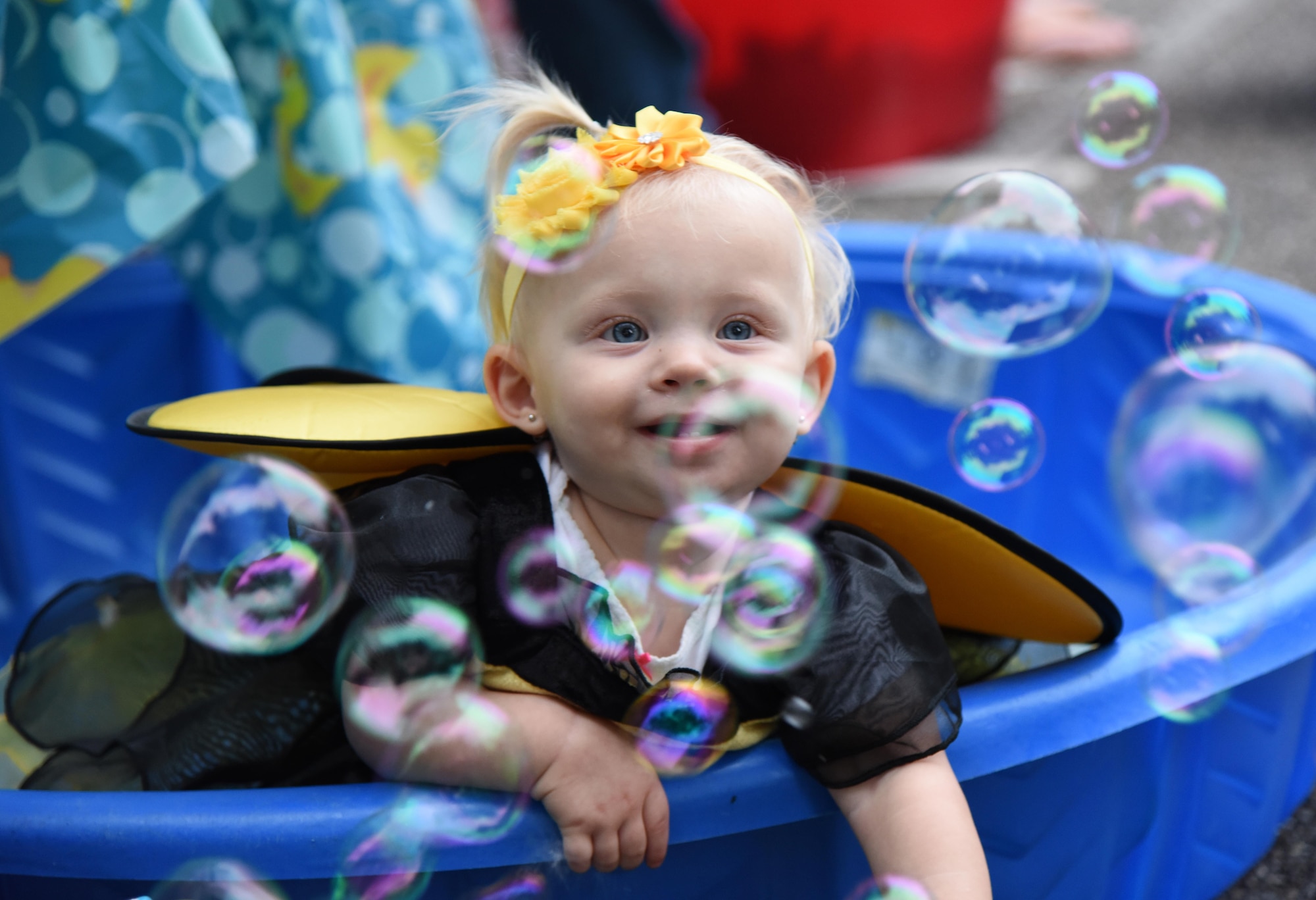 Quinn Ten Haken, daughter of Capt. Jason Ten Haken, 333rd Training Squadron instructor, portrays a bumble bee during Ghouls in the Park at Marina Park Oct. 27, 2017, on Keesler Air Force Base, Mississippi. Ghouls in the Park also featured an alien bus, a haunted house, “Trunk or Treat” and games for children of all ages. (U.S. Air Force photo by Kemberly Groue)