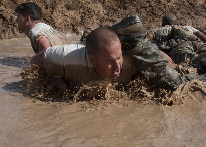 Members of the 377th Weapons Systems Security Squadron perform group fire-team push-ups during the “Team Punisher” portion of the Manzano Challenge at Kirtland Air Force Base, N.M., Oct. 27. The event saw 40 Airmen from the 377th Security Forces Group competing in different stations, ranging from weapons skills and land navigation to team tactics and problem solving.  (U.S. Air Force photo by Staff Sgt. J.D. Strong II)