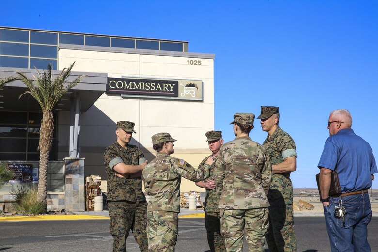 Marine Corps Air Ground Combat Center Commanding General Maj. Gen. William F. Mullen III, is briefed on the recent sanitary improvements by Army Lt. Col. Alisa R. Wilma, director of health and safety, Defense Commissary Agency, and Army Capt. Candace Wimbish, officer in charge, Twentynine Palms Veterinary Services, at the reopening of the Combat Center’s Commissary, Oct. 21, 2017. The command and DeCA worked diligently to restore the facility to the standards the patrons expect and deserve. (U.S. Marine photo by Pfc. Margaret Gale)