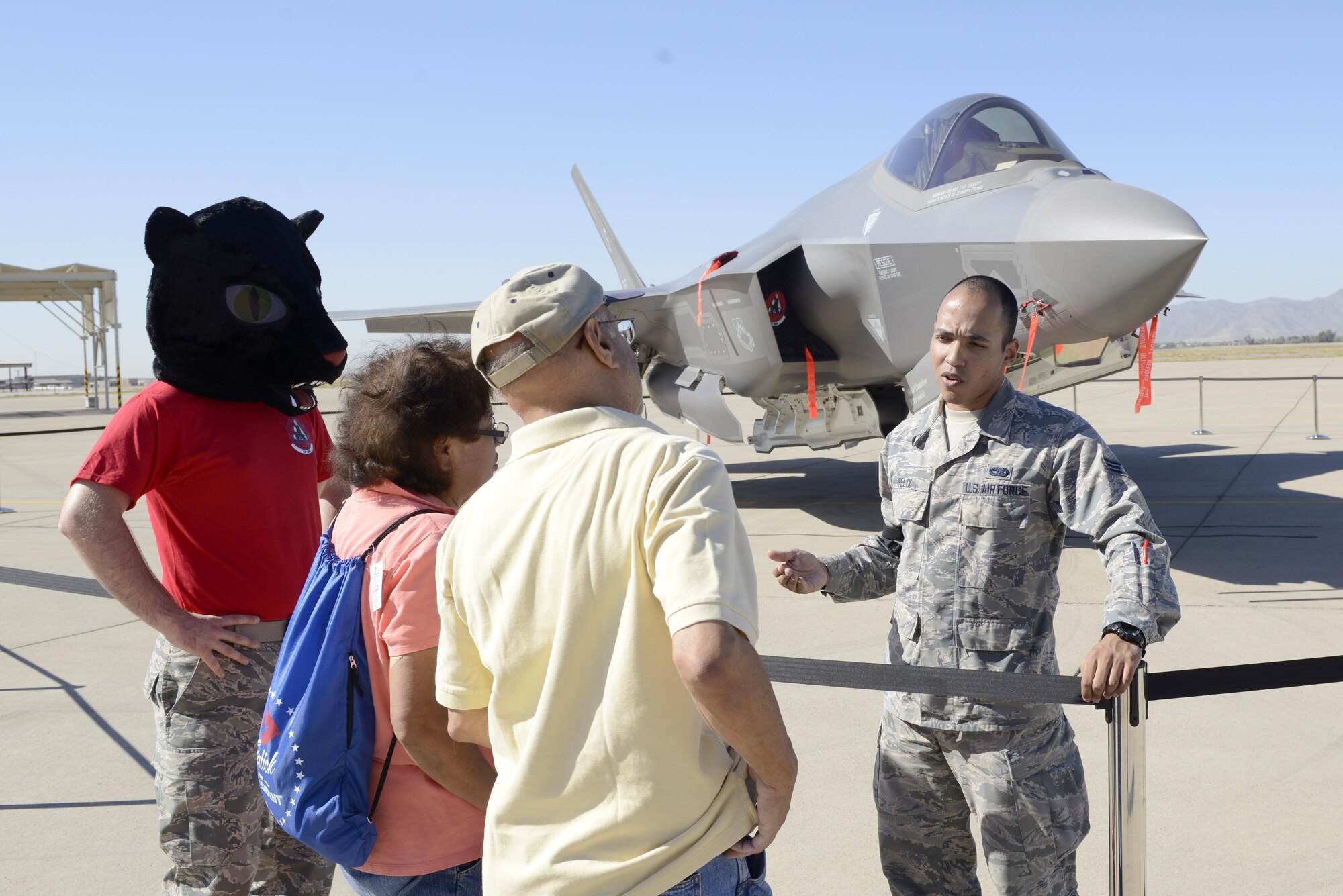 Senior Airman Anthony Felix, 63rd Aircraft Maintenance Unit crew chief (right), and Airman 1st Class Blayne Exline, 63rd AMU assistant dedicated crew chief, showcase the F-35A Lightning II to retirees at Luke Air Force Base, Ariz., Oct. 28, 2017. During the Retiree Appreciation Day event, system matter experts were placed around an F-35 and F-16 Fighting Falcon static displays to answer any questions the retirees had. (U.S. Air Force photo/Airman 1st Class Pedro Mota)