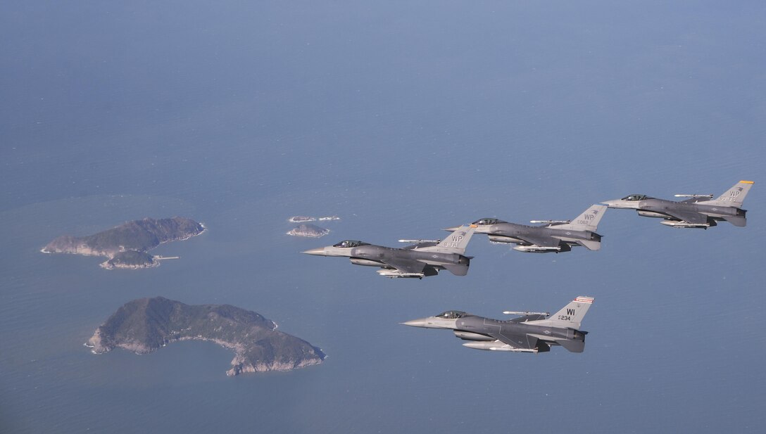 U.S. Air Force pilots assigned to the 8th Fighter Wing and a pilot assigned to the Wisconsin Air National Guard’s 176th Fighter Squadron fly in fingertip formation in the airspace around Kunsan Air Base, Republic of Korea, Oct. 30, 2017. The 176th FS, assigned to the 115th Fighter Wing, is currently deployed to Kunsan as part of a theater security package to enable and enhance U.S. partnerships and regional security.