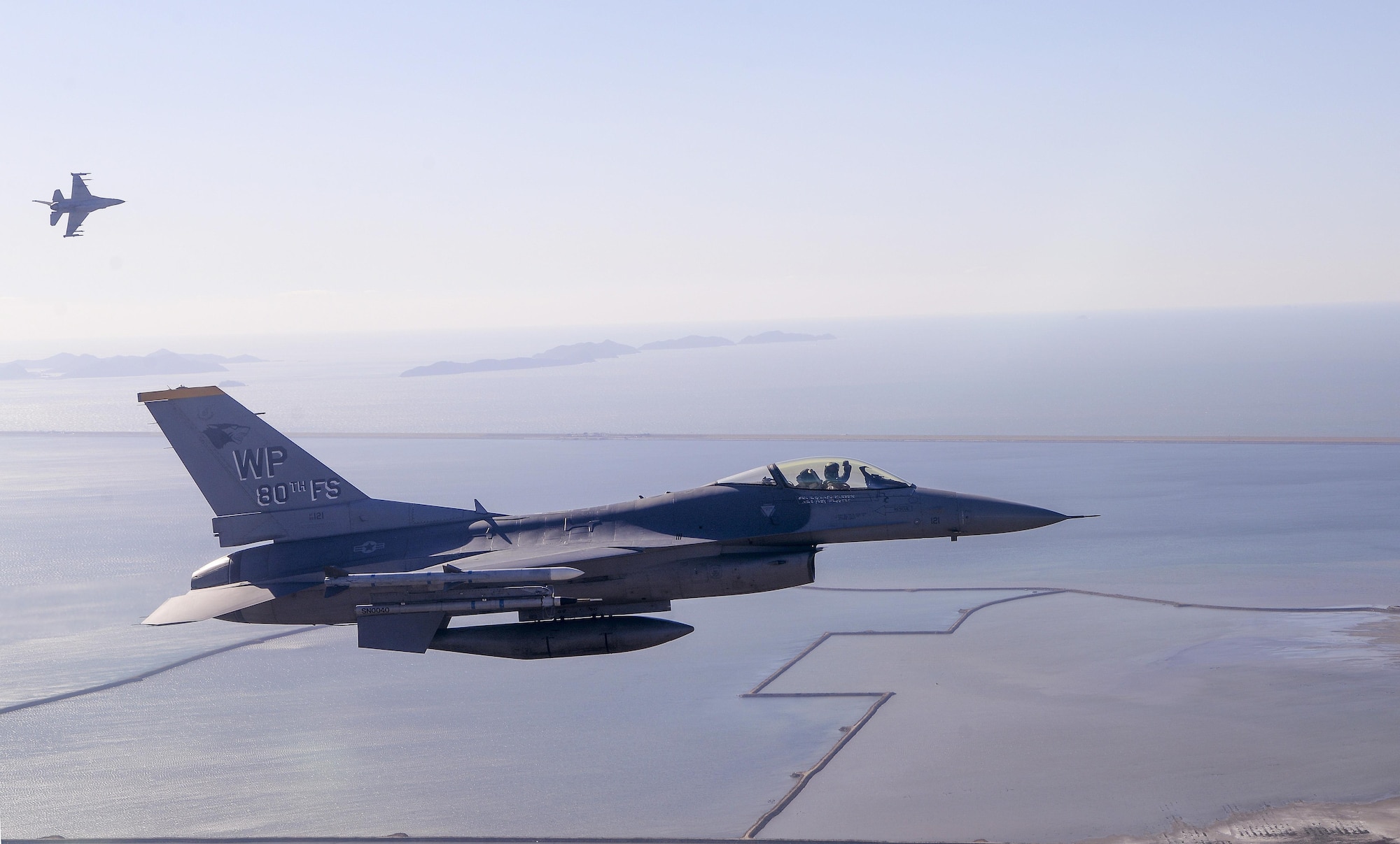 Lt. Col. Kurt Distelzweig, 35th Fighter Squadron commander, breaks left for his initial approach to Kunsan Air Base, Republic of Korea with Lt. Col. William Lutmer, 80th Fighter Squadron commander after finishing a fingertip formation flight, Oct. 30, 2017. This mission included the U.S. Air Force's 8th Fighter Wing and 115th Fighter Wing as well as the Republic of Korea Air Force's 38th Fighter Group, enabling pilots to communicate and hone skills necessary to carry out combined missions as a cohesive component.