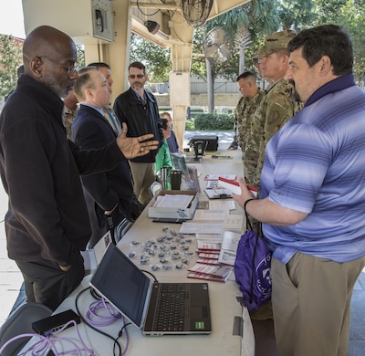 Experts in cybersecurity share information with USCENTCOM personnel during a cybersecurity awareness expo, October 26, 2017. The expo provided the opportunity for personnel and family members to talk with subject matter experts and view exhibits that highlight best security practices, in the workplace and home, to protect critical and personal information online.