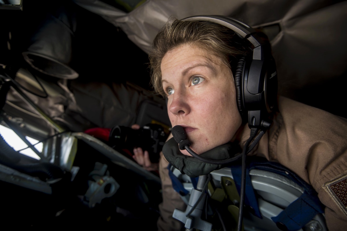 A boom operator concentrates as she prepares to refuel an aircraft.