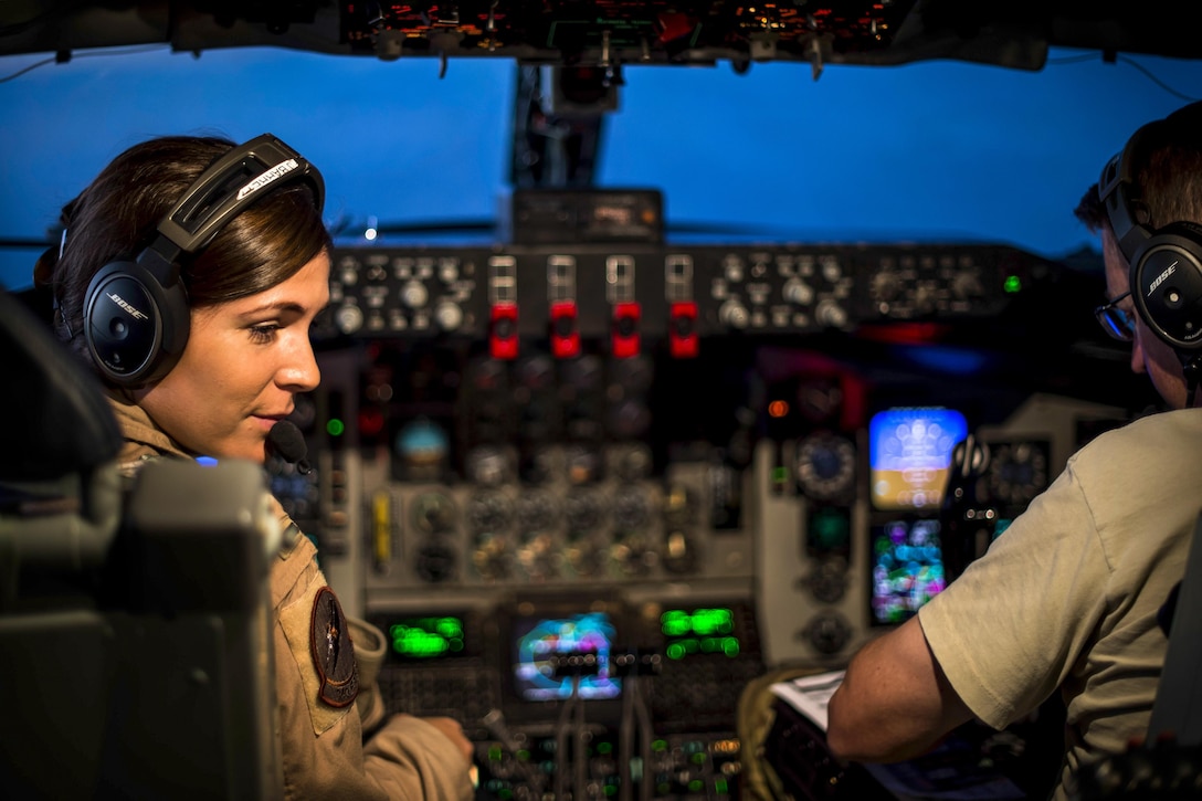 Two aircraft pilots fly an aircraft over Iraq.