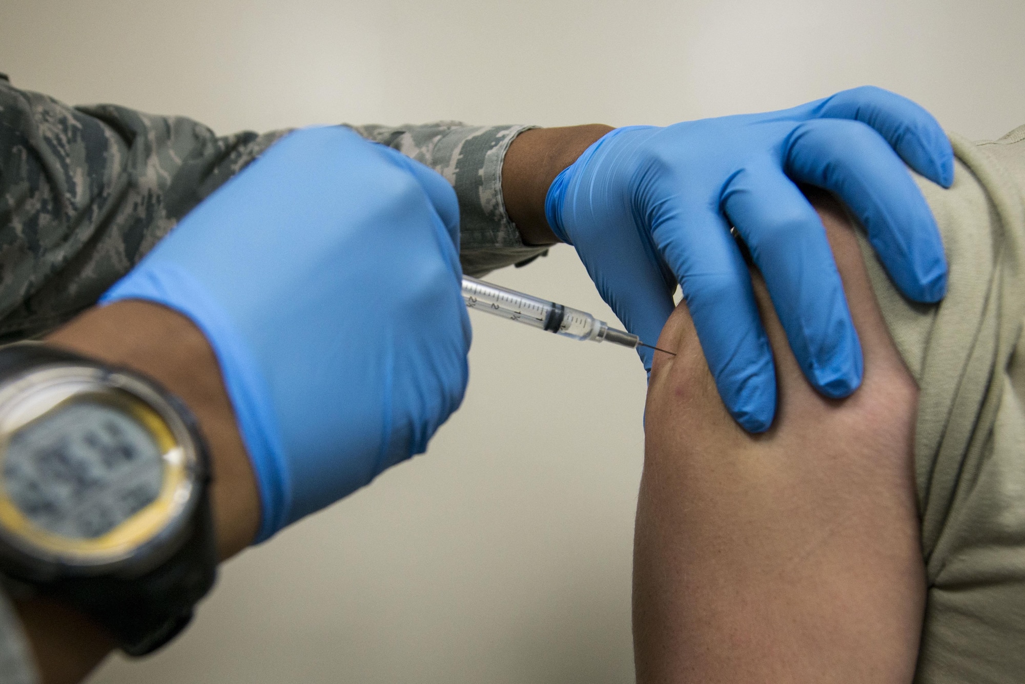 U.S. Air Force Senior Airman Tamika Bradley, 20th Medical Operations Squadron allergy and immunizations technician, injects a vaccine into a patient at Shaw Air Force Base, South Carolina, Oct. 23, 2017.