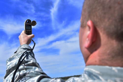 Staff Sgt. Jason Parsons, 19th Operations Support Squadron NCO in charge of the weather flight, checks weather conditions with a Kestrel weather meter Oct. 23, 2017, at Little Rock Air Force Base, Ark. The Kestrel weather meter is capable of measuring temperature, wind speed, air pressure and other weather conditions. (U.S. Air Force photo by Airman Rhett Isbell)