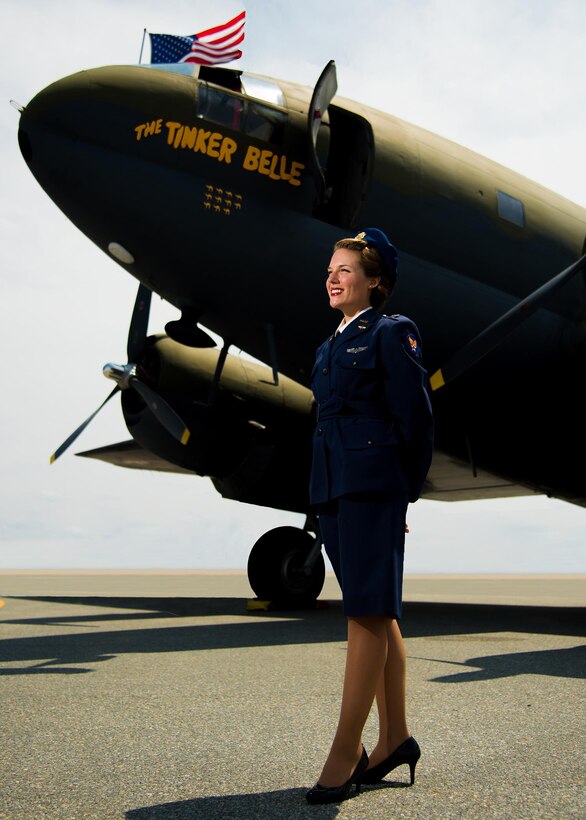 Tricia Upchurch, Air Mobility Command Museum volunteer educator, poses next to a Curtiss C-46 airplane during the 2017 Thunder Over Dover Open House and Airshow Aug. 27, 2017, at Dover Air Force Base, Del.