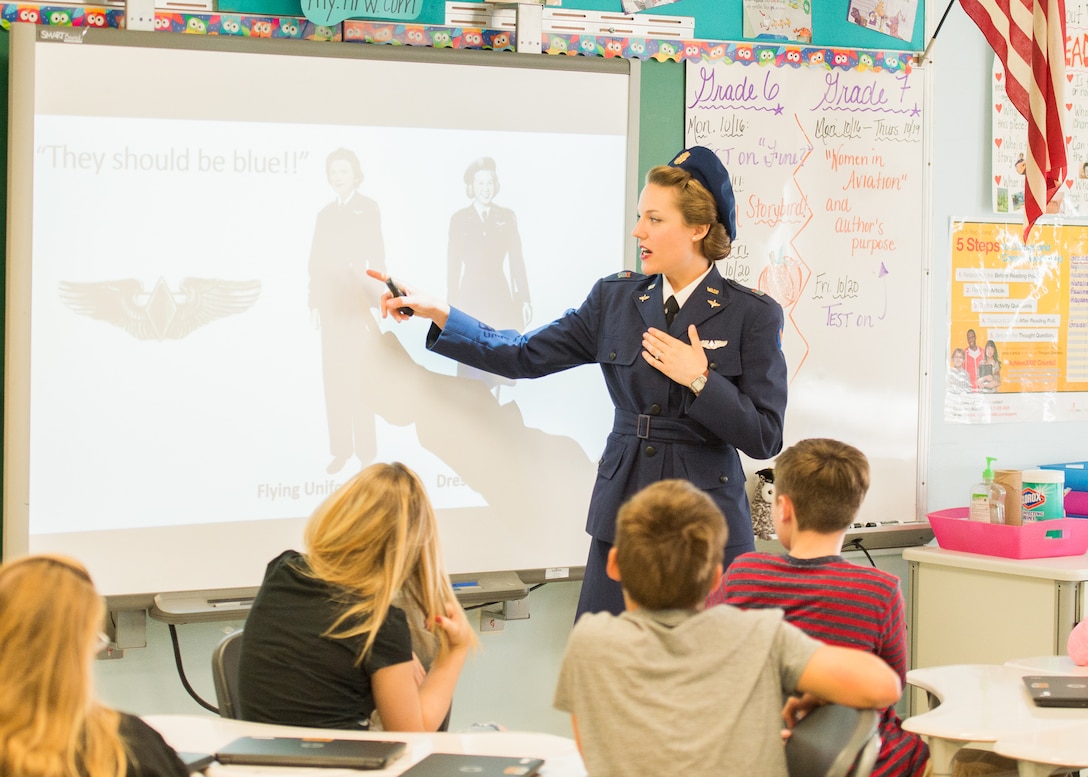 Tricia Upchurch, Air Mobility Command Museum volunteer educator, gives a history lesson to a class of 7th graders Oct. 19, 2017, at Dover Air Force Base Middle School on Dover Air Force Base, Del.