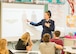 Tricia Upchurch, Air Mobility Command Museum volunteer educator, gives a history lesson to a class of 7th graders Oct. 19, 2017, at Dover Air Force Base Middle School on Dover Air Force Base, Del.