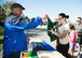 Wil Roberson, sexual assault victim advocate, hands out gift towels during the 2017 Zombie Fun Run Oct. 27, 2017, at Dover Air Force Base, Del.