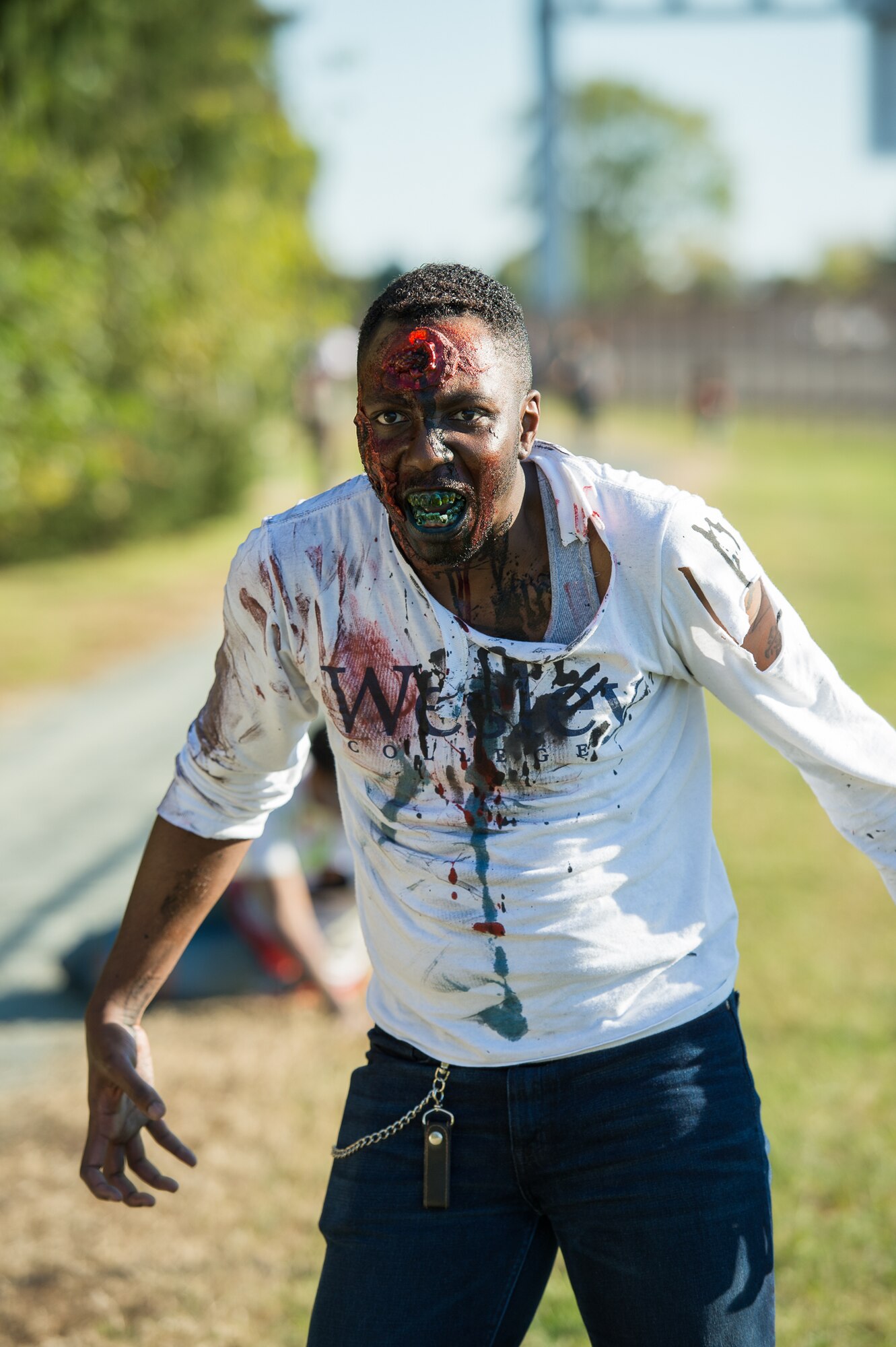 Senior Airman Jeron Gordon, 436th Medical Operations Squadron mental health technician, waits for his next victim during the 2017 Zombie Fun Run Oct. 27, 2017, at Dover Air Force Base, Del.