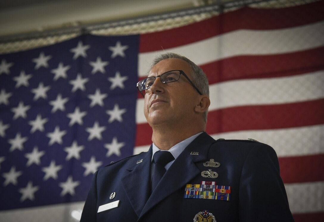 Outgoing 108th Mission Suport Group Commander Col. Vito Dimicco prepares to be awarded the Meritorious Service Medal during a ceremony at Joint Base McGuire-Dix-Lakehurst, N.J., Oct. 15, 2017. (U.S. Air National Guard photo by Master Sgt. Matt Hecht)