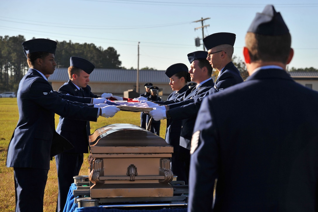 U.S. Airmen temporarily assigned to the 20th Force Support Squadron Honor Guard perform a simulated funeral detail during an honor guard graduation at Shaw Air Force Base, South Carolina, Oct. 30, 2017.