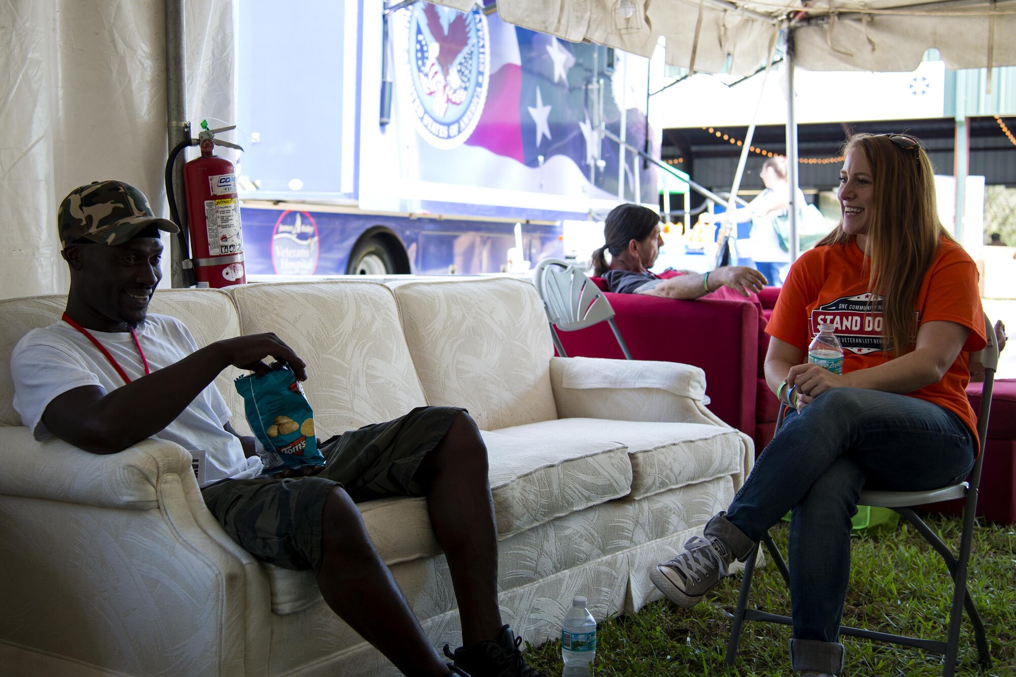 Staff Sgt. Samantha Murphy, 23d Wing command post NCO in charge of systems, right, and Paul, a U.S. Navy veteran, share a laugh during a Stand Down event, Sept. 29, 2017, at Spring Hill, Fla. Pursuing a Master’s Degree in Social Work, Murphy spent three days at the event helping veterans by providing counseling and social work. Throughout the year, Stand Down events are held around the country to provide a plethora of services and aide to homeless and at-risk veterans. (U.S. Air Force photo by Airman 1st Class Erick Requadt)