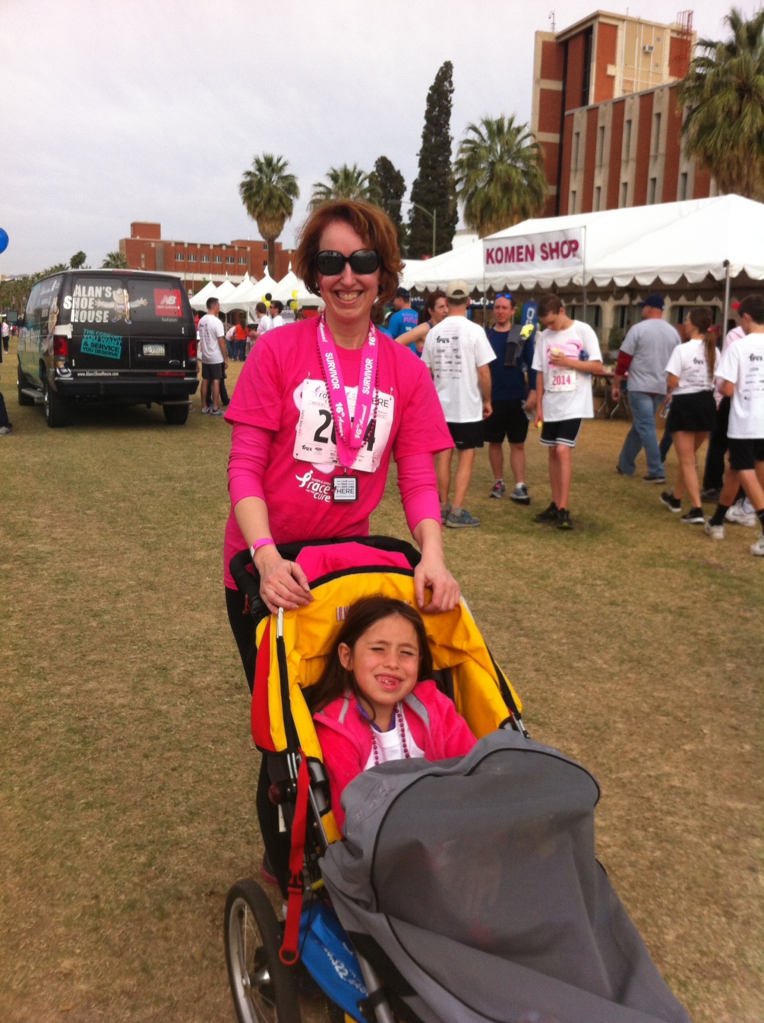 Col. Theresa Medina, 319th Medical Group commander, and her daughter Sophia, pose for a photo after participating in the Susan G. Komen Race for the Cure event April 1, 2014. Medina was diagnosed with stage one breast cancer in 2011 and overcame the illness with the help of Tricare and the support of family and friends. (Courtesy photo)