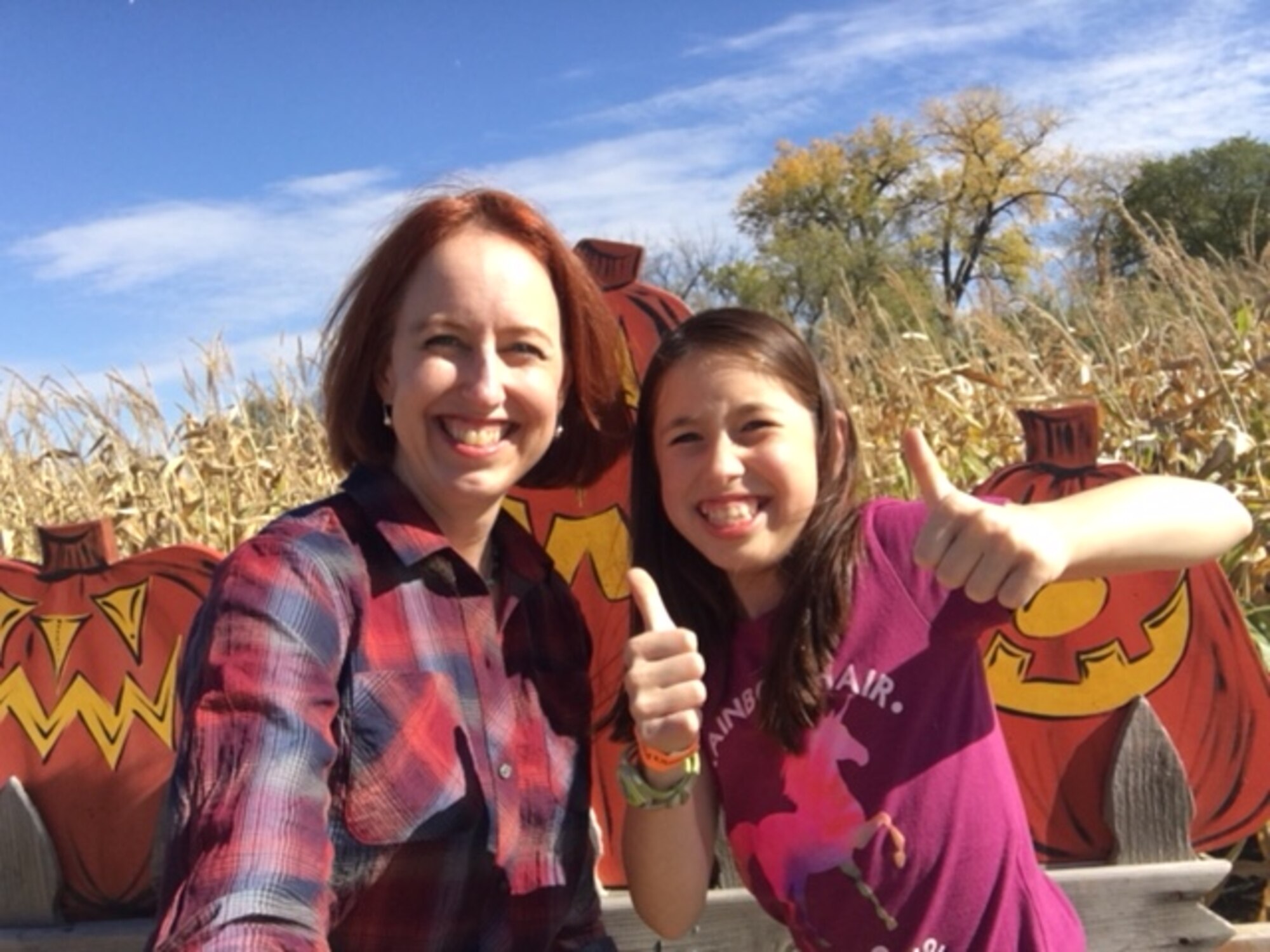 Col. Theresa Medina, 319th Medical Group commander, and her daughter Sophia, pose for a photo at a harvest festival Oct. 7, 2017 at Grand Forks, North Dakota. Medina was diagnosed with stage one breast cancer on Nov. 3, 2011, but with the help of Tricare and the support of family and friends she is now cancer free. (Courtesy photo)