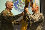 Maj. Gen. Richard Gallant, commander, Joint Task Force Civil Support, Chief Master Sgt. James Brown, senior enlisted leader, JTF-CS and Master Chief Jeffrey Covington, senior enlisted leader, JTF-CS participate in a Change of Responsibility ceremony here Oct. 27, 2017. Brown is the ninth senior enlisted leader to take responsibility of JTF-CS in its 18 year history.