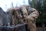 Soldiers with the 25th Infantry Division in Hawaii tackle obstacles in February 2017, while evaluating a new, lighter-weight uniform.