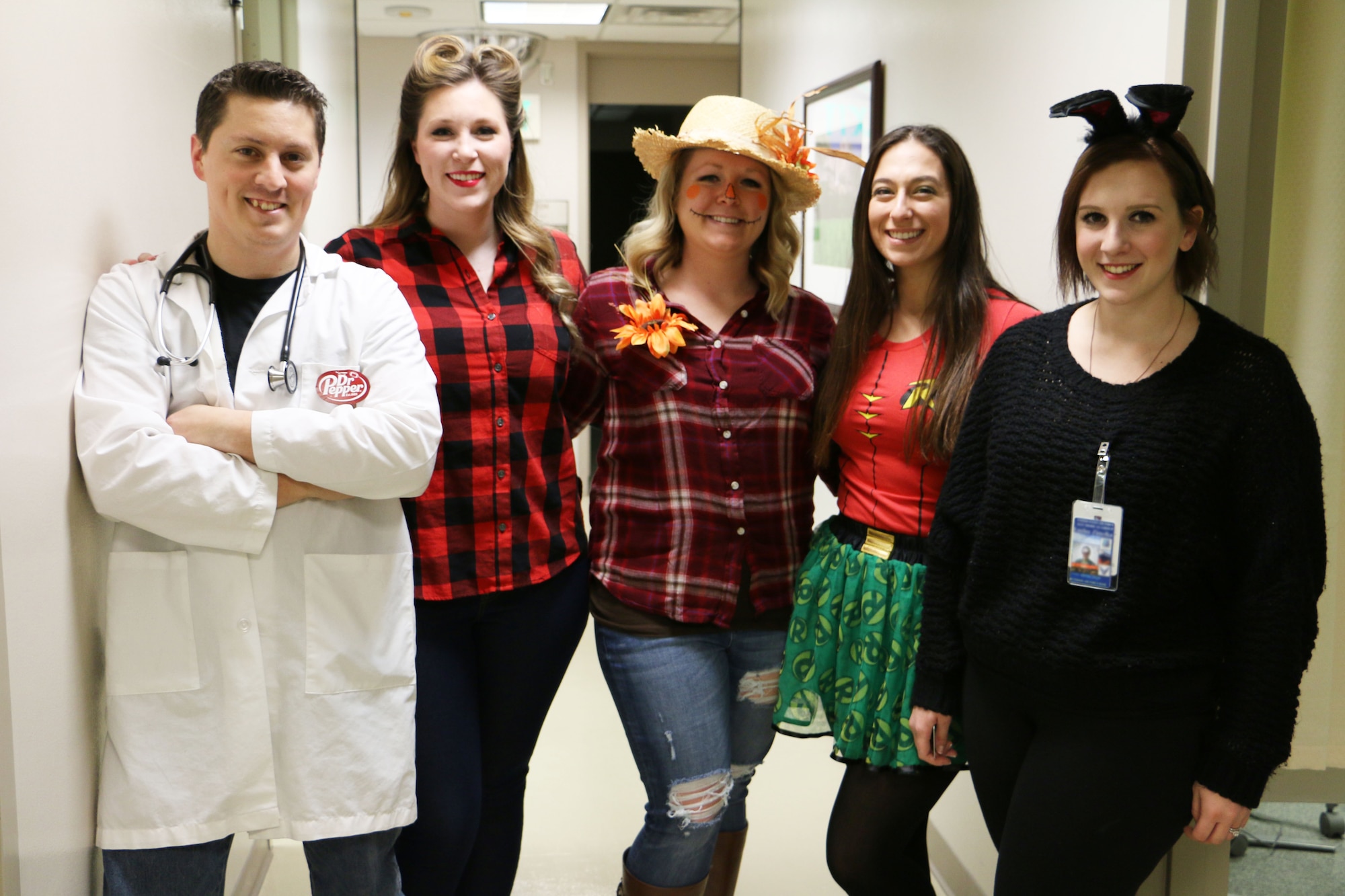 Members of the 21st Medical Group Family Health Team A show-off their costumes Oct. 31, 2017 at Peterson Air Force Base, Colorado. Some units on Peterson AFB dressed in costume to celebrate Halloween. (U.S. Air Force photo by Staff Sgt. Erica Picariello)