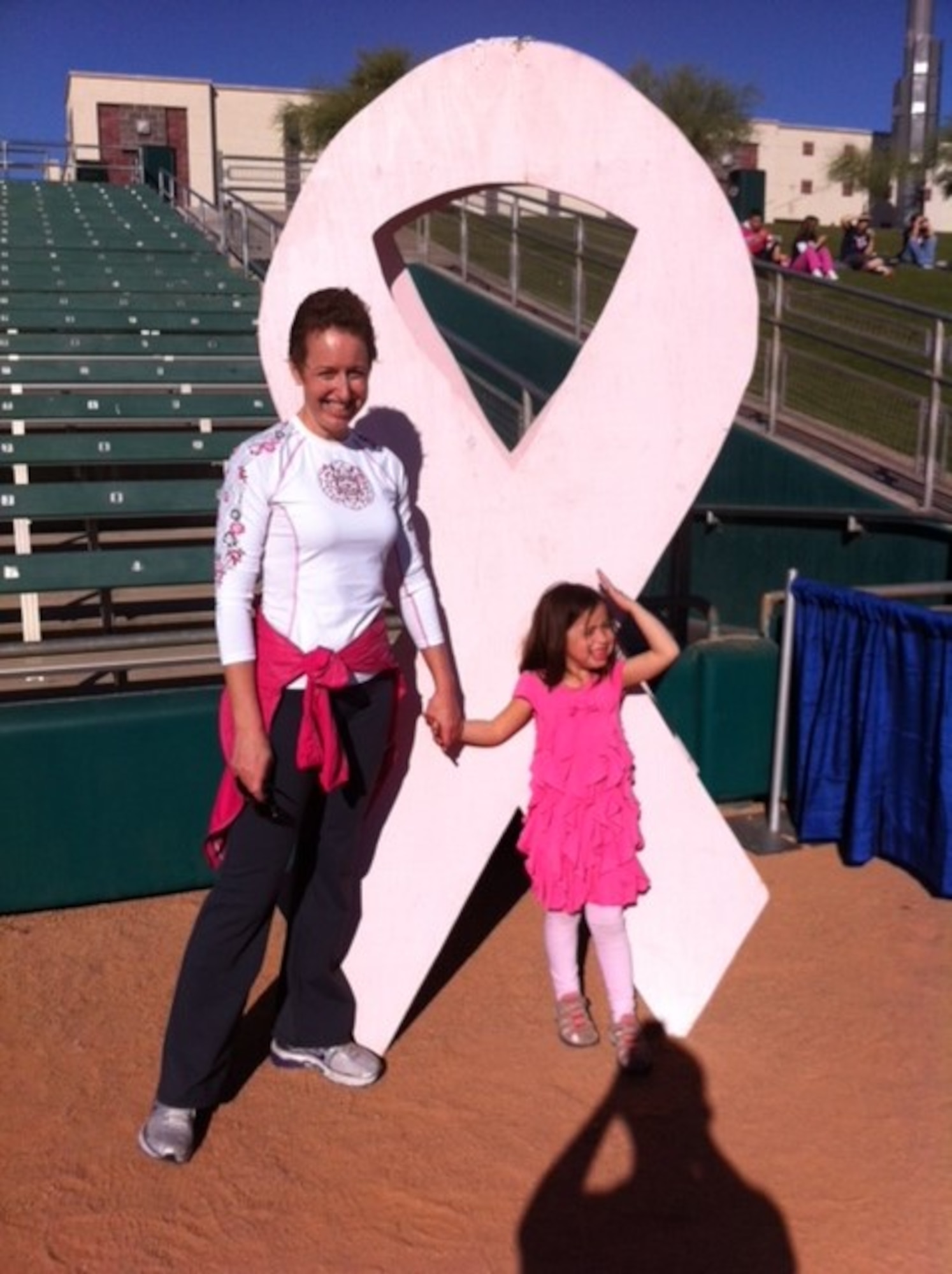 Col. Theresa Medina, 319th Medical Group commander, and her daughter Sophia, pose for a photo Oct. 28, 2012. Medina was diagnosed with stage one breast cancer in 2011, and, with the help of Tricare and the support of her family and friends, she overcame the illness and is now cancer free. (Courtesy photo)