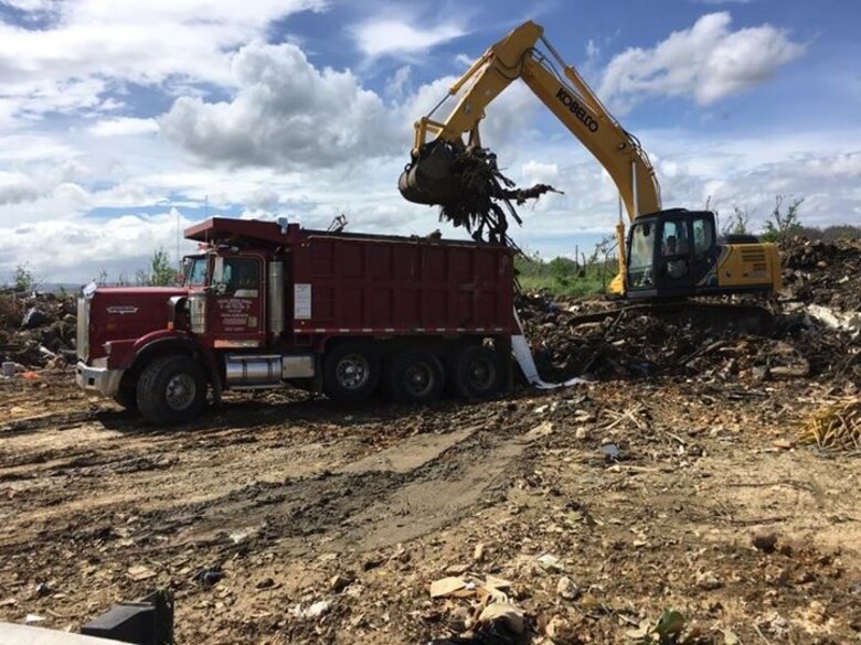 A USACE contractor loads debris into a truck in Toa Baja, Puerto Rico.