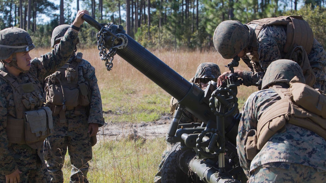 Marines sight in on a post to align the 120-mm mortar during a life-fire artillery exercise as part of Exercise Bold Alligator at Camp Lejeune, N.C., Oct. 23, 2017. Bold Alligator is designed to showcase the capabilities of the Navy-Marine Corps team, and demonstrate our cohesion with allied nations. The U.S. Marines and British troops gained camaraderie through integrated training, allowing them to familiarize themselves with each other’s capabilities. (U.S. Marine Corps Photo by Pfc. Nicholas Guevara)