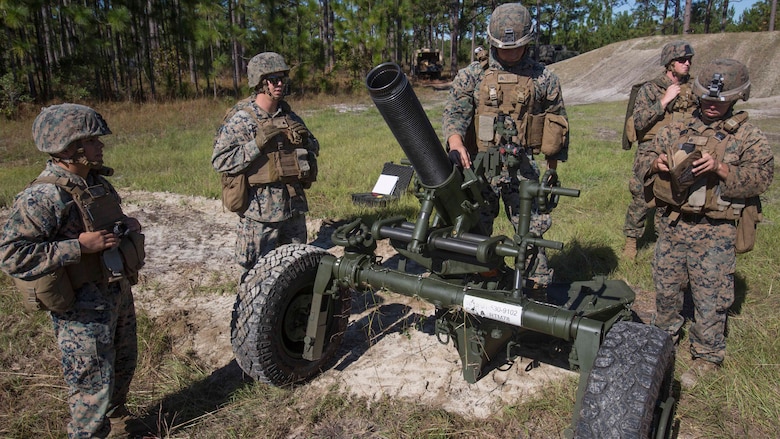 Marines inspect a 120-mm mortar to before firing down range as part of Exercise Bold Alligator at Camp Lejeune, N.C. Oct. 23, 2017. Bold Alligator is designed to showcase the capabilities of the Navy-Marine Corps team, and demonstrate our cohesion with allied nations. The U.S. Marines and British troops gained camaraderie through integrated training, allowing them to familiarize themselves with each other’s capabilities. (U.S. Marine Corps Photo by Pfc. Nicholas Guevara)