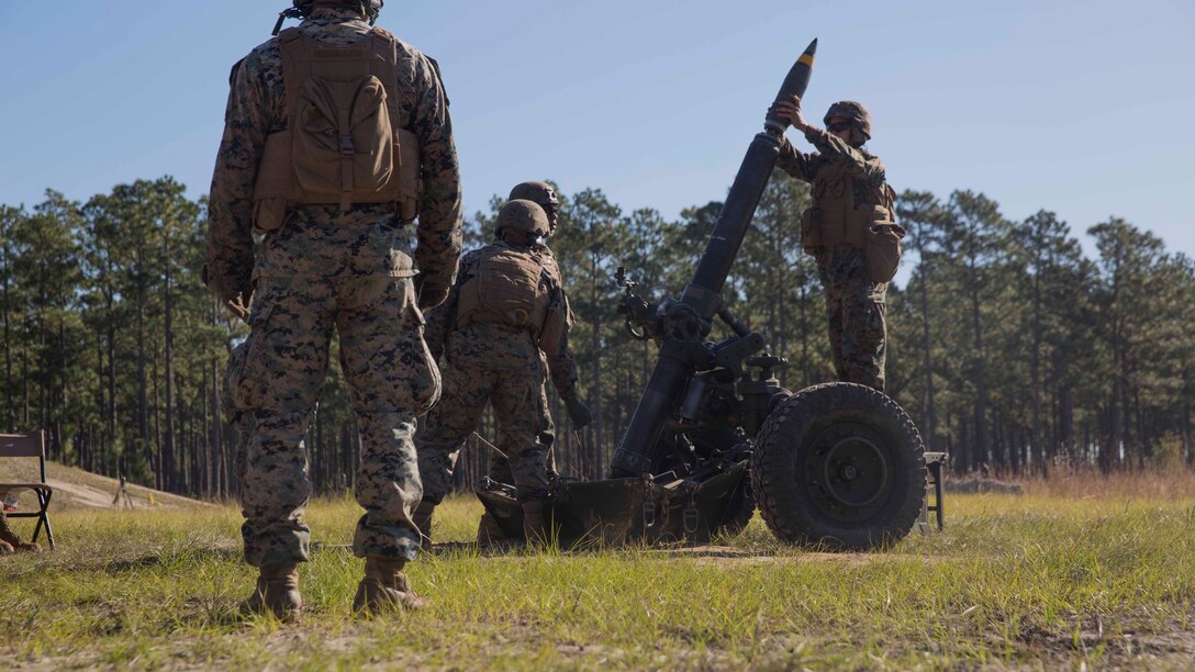 Marines load a round into a 120-mm mortar as they prepare to fire down range as part of Exercise Bold Alligator at Camp Lejeune, N.C. Oct. 23, 2017. Bold Alligator is designed to showcase the capabilities of the Navy-Marine Corps team, and demonstrate our cohesion with allied nations. The U.S. Marines and British troops gained camaraderie through integrated training, allowing them to familiarize themselves with each other’s capabilities. (U.S. Marine Corps Photo by Pfc. Nicholas Guevara)