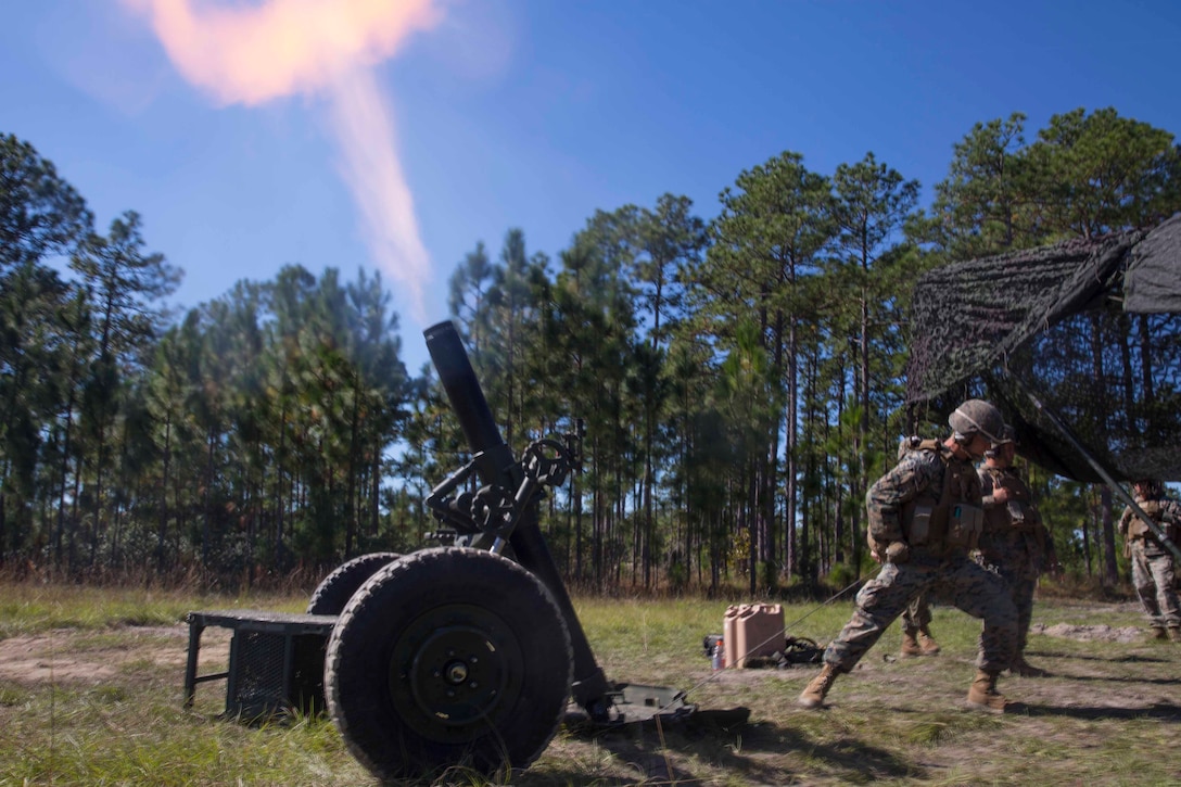 A Marine fires a 120-mm mortar downrange during a life-fire artillery exercise as part of Exercise Bold Alligator at Camp Lejeune, N.C. Oct. 23, 2017. Bold Alligator is designed to showcase the capabilities of the Navy-Marine Corps team, and demonstrate our cohesion with allied nations. The U.S. Marines and British troops gained camaraderie through integrated training, allowing them to familiarize themselves with each other’s capabilities. (U.S. Marine Corps Photo by Pfc. Nicholas Guevara)
