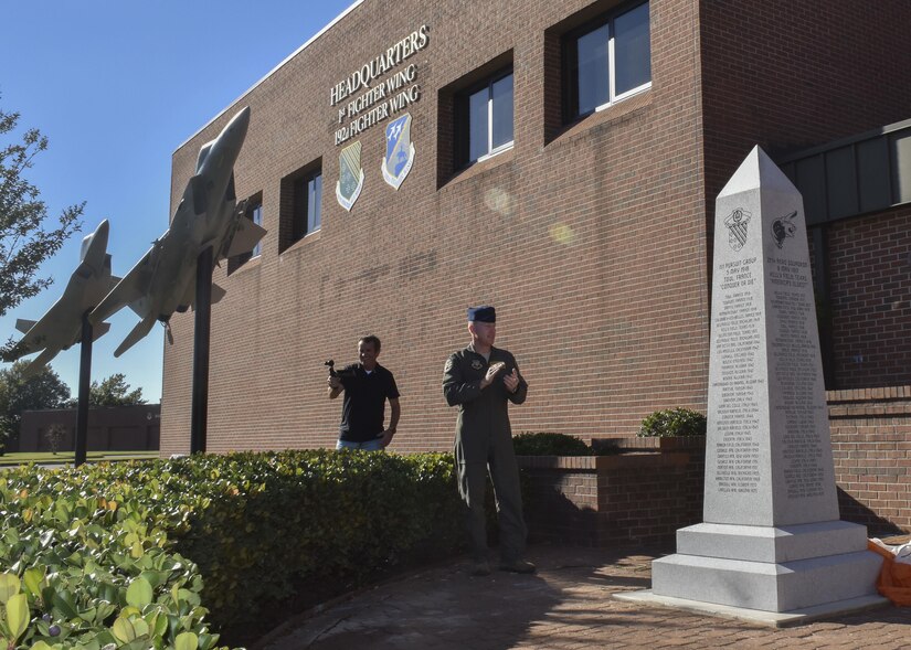 U.S. Air Force Col. Jason Hinds, 1st Fighter Wing commander, unveils the 100-year monument as part of the 1st FW’s centennial celebration at Joint Base Langley-Eustis, Va., Oct. 27, 2017.
