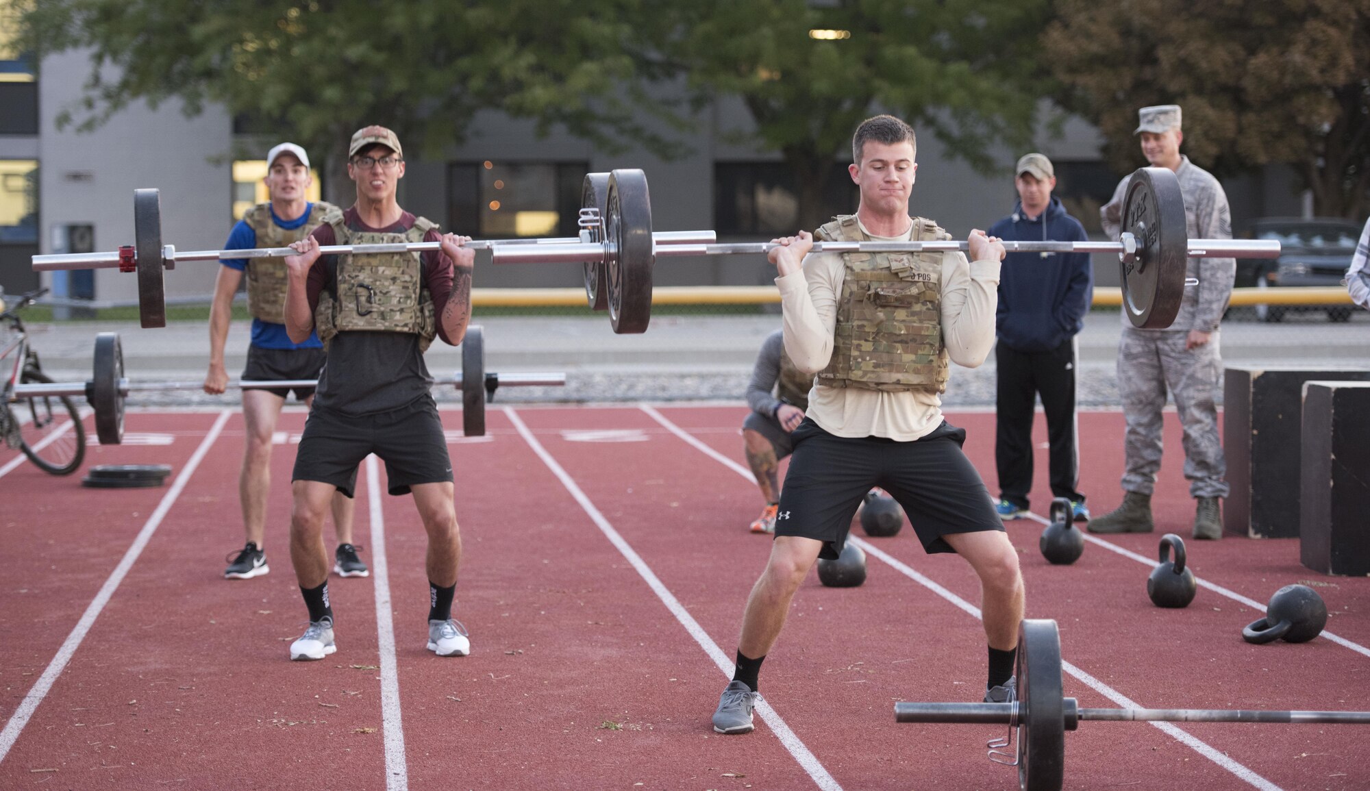 Airmen from the 366th Civil Engineer Squadron explosive ordnance disposal unit lift weights at the EOD memorial workout Sept. 29, 2017, at Mountain Home Air Force Base, Idaho. The workout was performed in remembrance of all the EOD technicians who lost their lives after Sept. 11, 2001. (U.S. Air Force photo by Airman 1st Class Alaysia Berry)