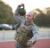 An Airman from the 366th Civil Engineer explosive ordnance disposal unit lifts a kettlebell at the EOD memorial workout Sept. 29, 2017, at Mountain Home Air Force Base, Idaho. The workout involved weighted front squats, kettle bell swings, barbell rows, chest-to-bar pull-ups and a run. (U.S. Air Force photo by Airman 1st Class Alaysia Berry)