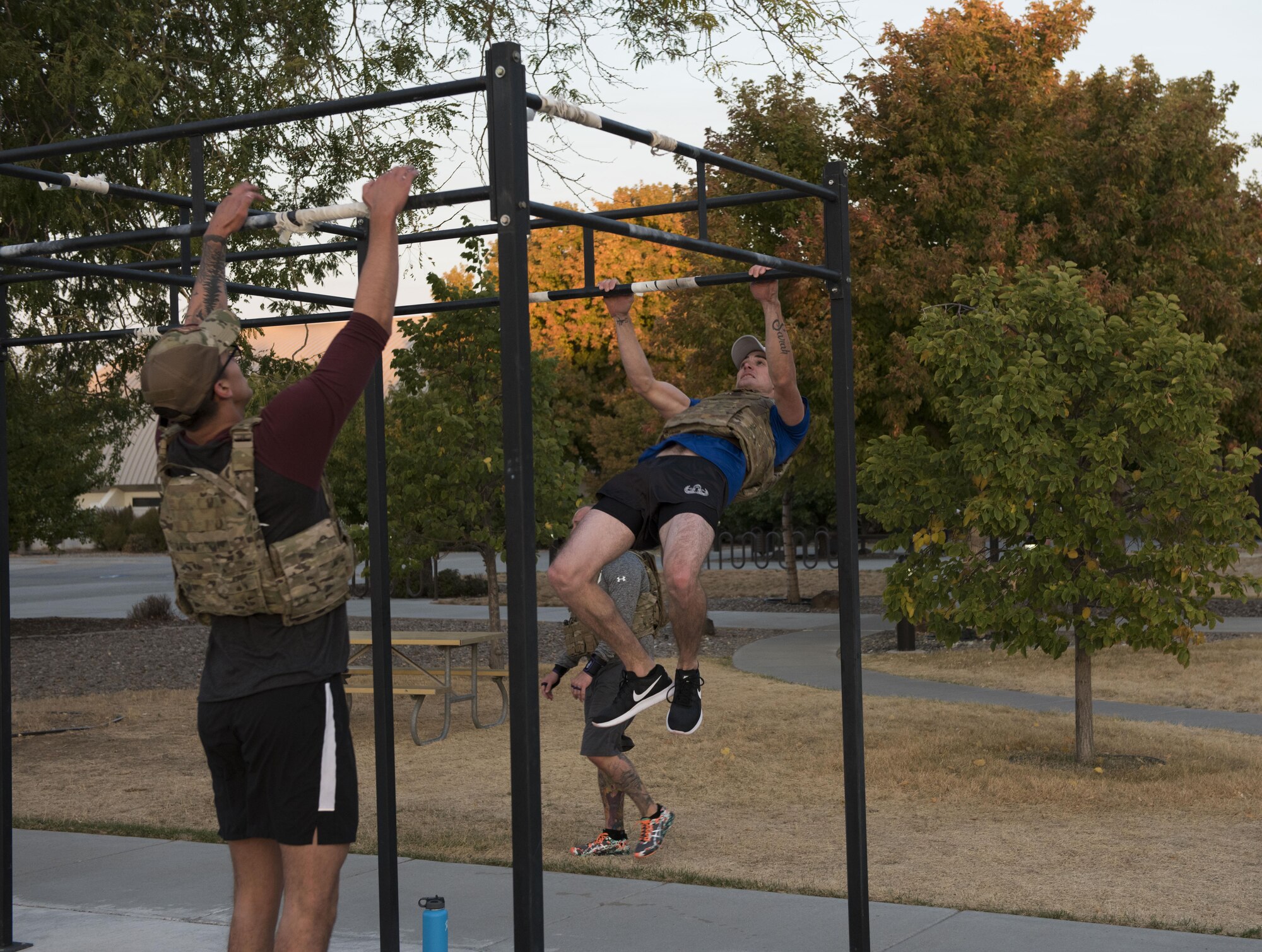 Airmen from the 366th Civil Engineer Squadron explosive ordnance disposal unit perform pull-ups at the EOD memorial workout Sept. 29, 2017, at Mountain Home Air Force Base, Idaho. The workout involved weighted front squats, kettle bell swings, barbell rows, chest-to-bar pull-ups and a run. (U.S. Air Force photo by Airman 1st Class Alaysia Berry)